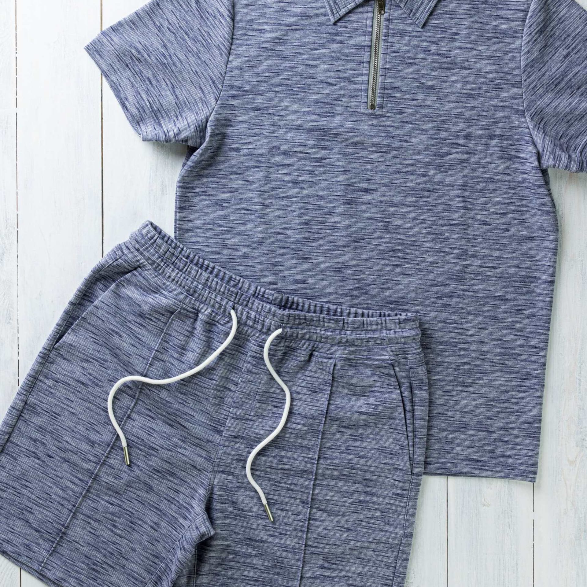 Mens blue marl polo and shorts set flat lay - clothing photography UK