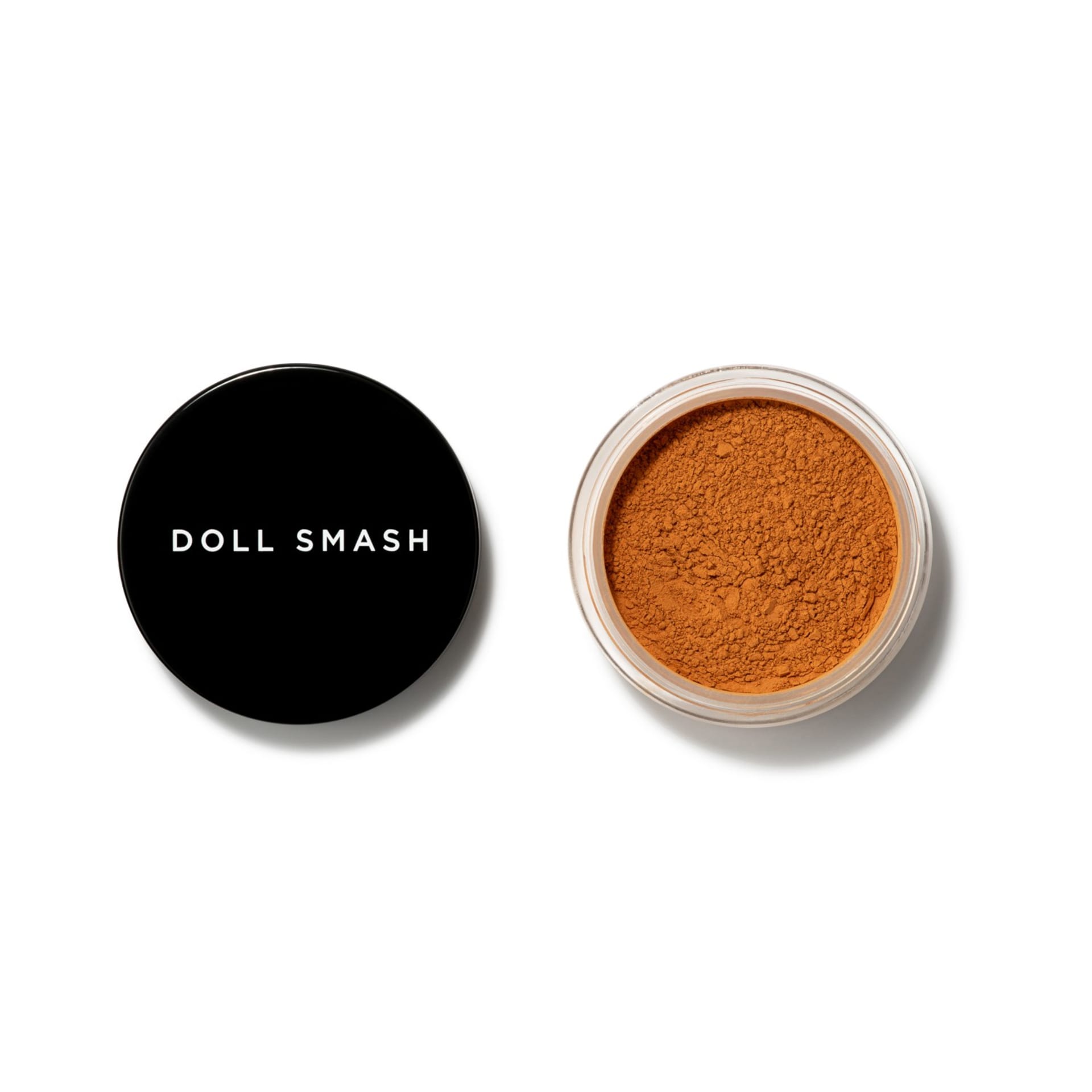 Loose powder foundation with open jar and lid packshot - beauty makeup product photography UK