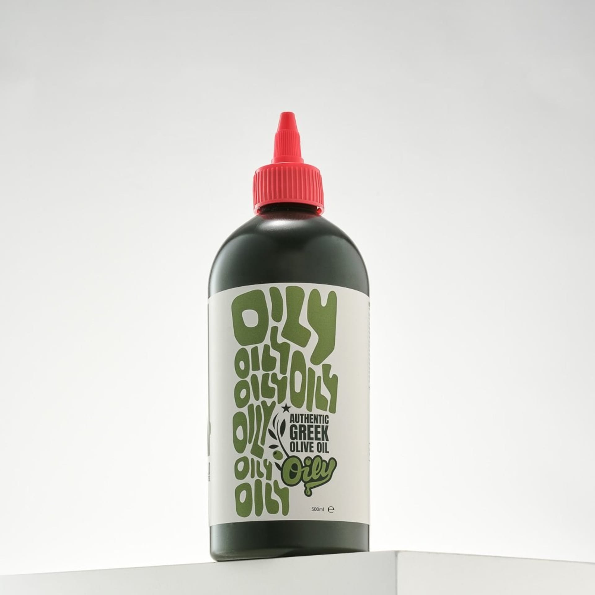 Greek olive oil bottle packshot with red cap minimal - bottle photography UK