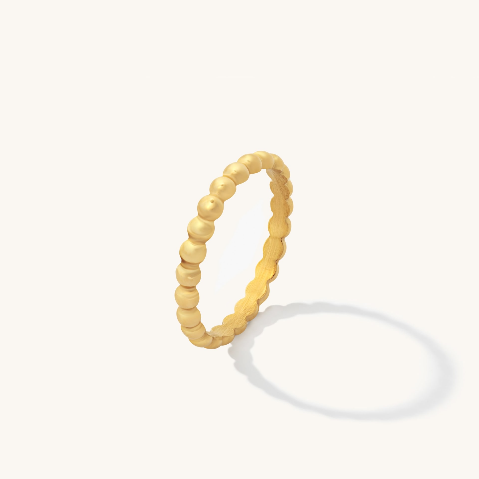 Gold beaded ring packshot on white background minimal - jewellery product photography UK