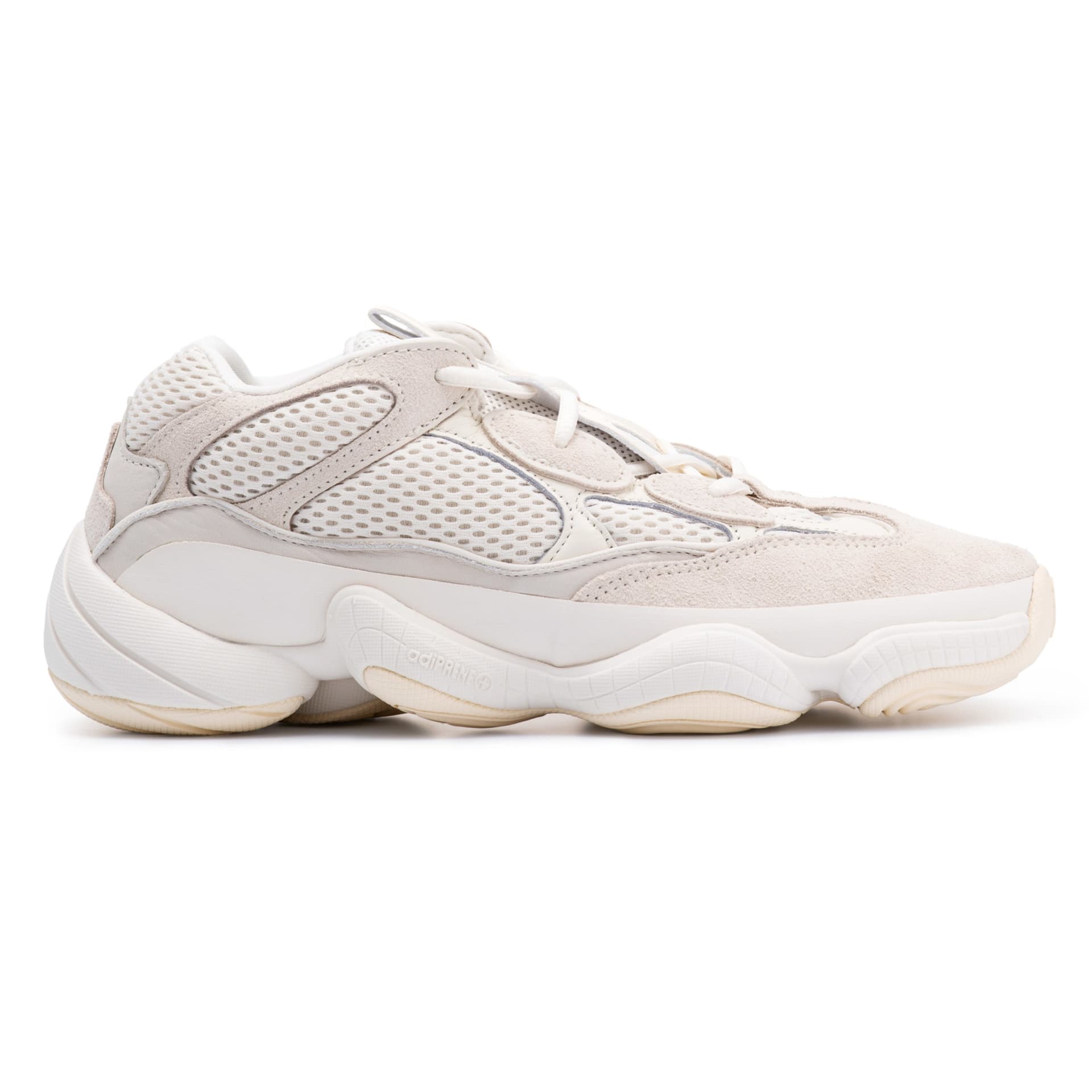 Cream chunky sneaker side profile packshot on white - footwear product photography UK