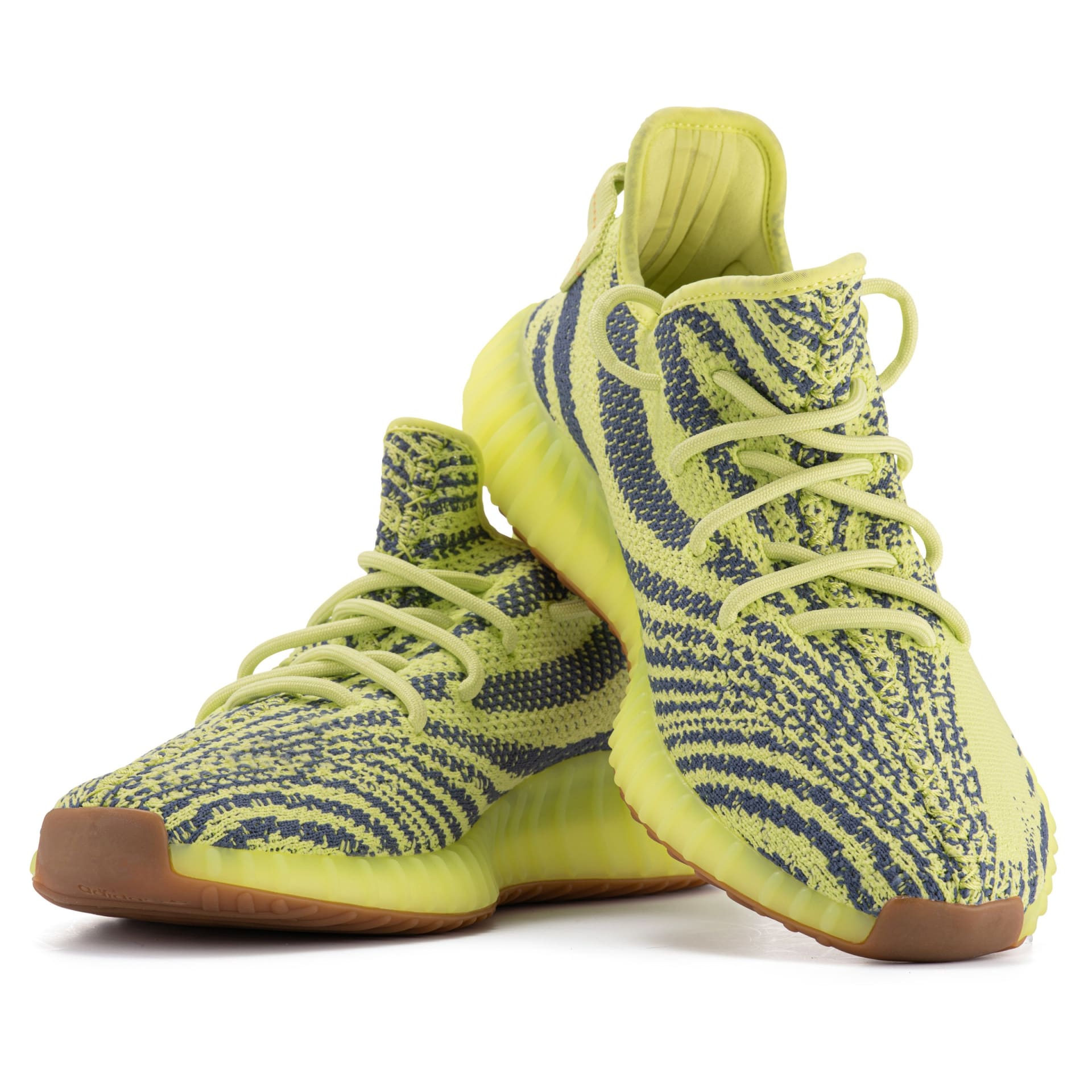 Yellow and grey knit sneakers pair packshot on white background - footwear product photography UK