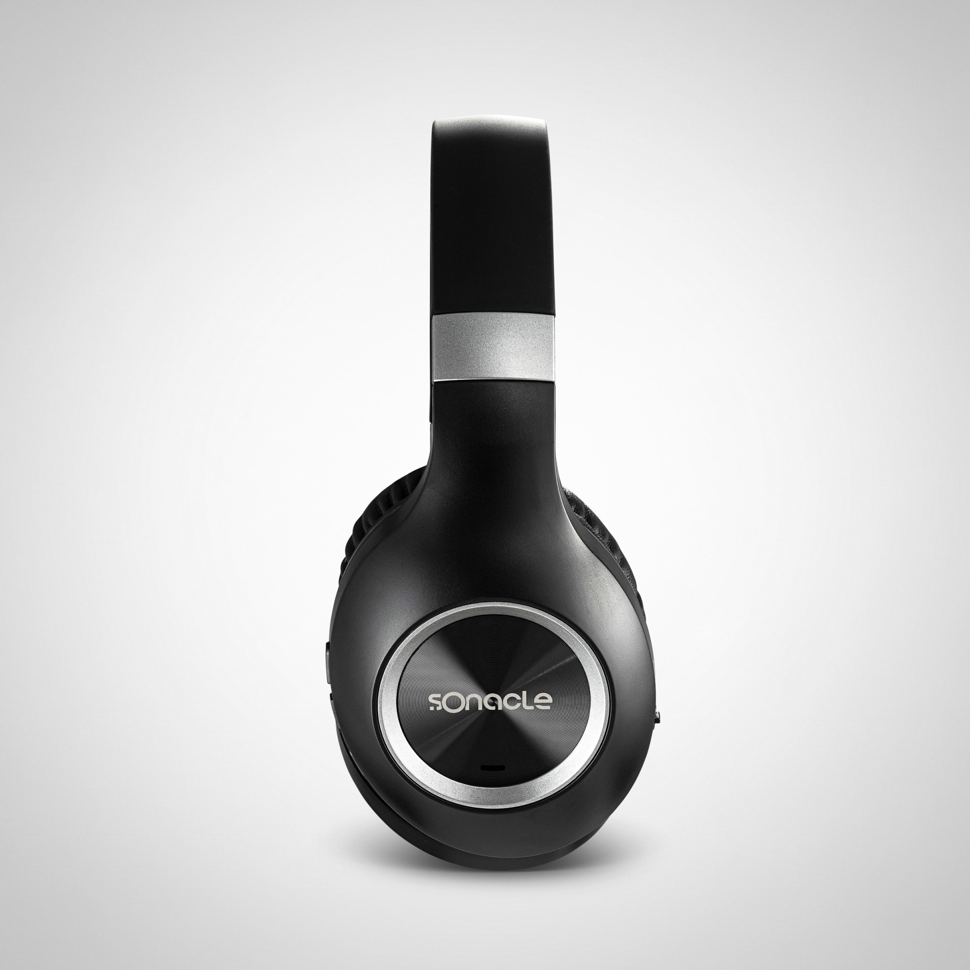 Black wireless headphones packshot on white background - technology photography UK