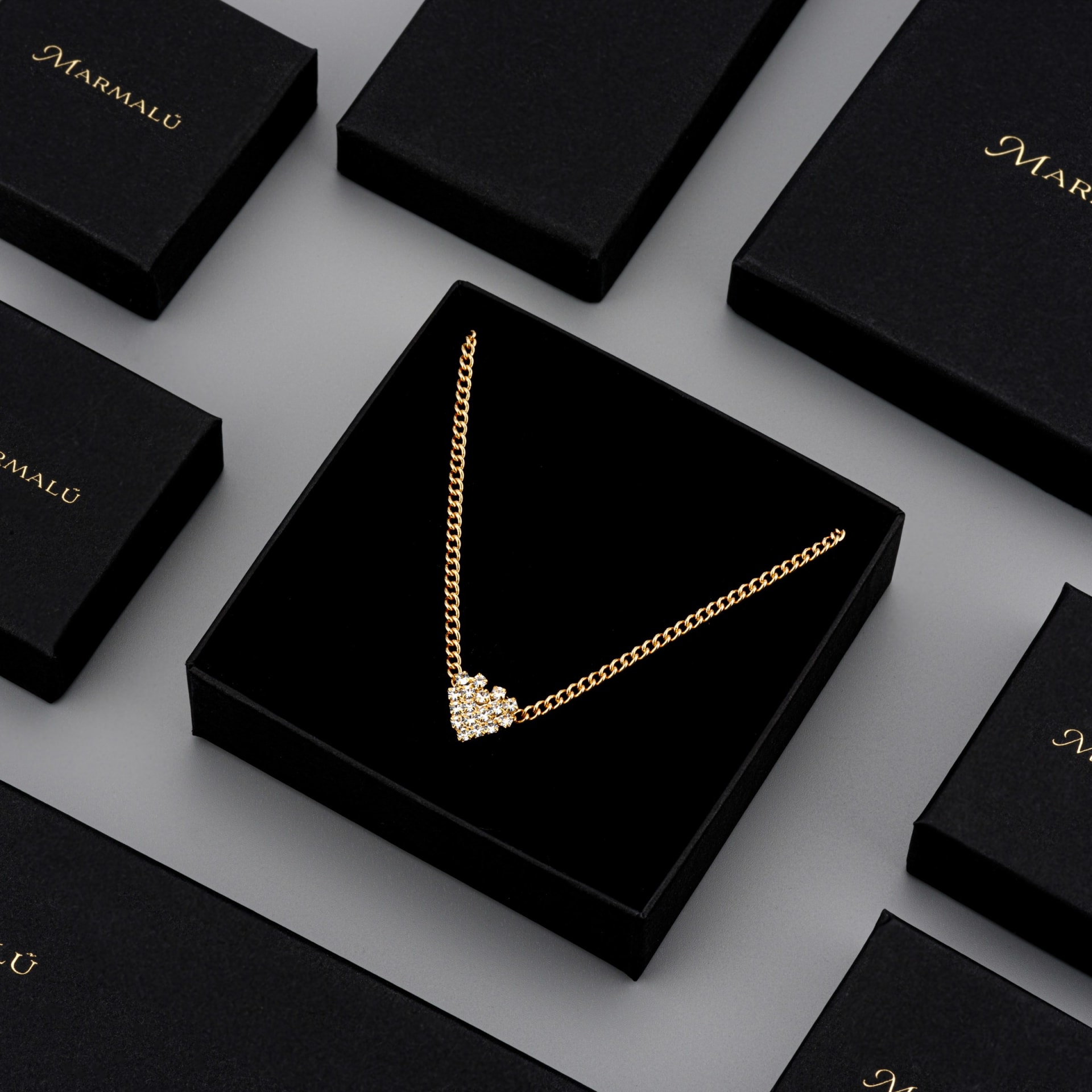 Gold heart necklace in black gift box - luxury jewellery packaging photography UK