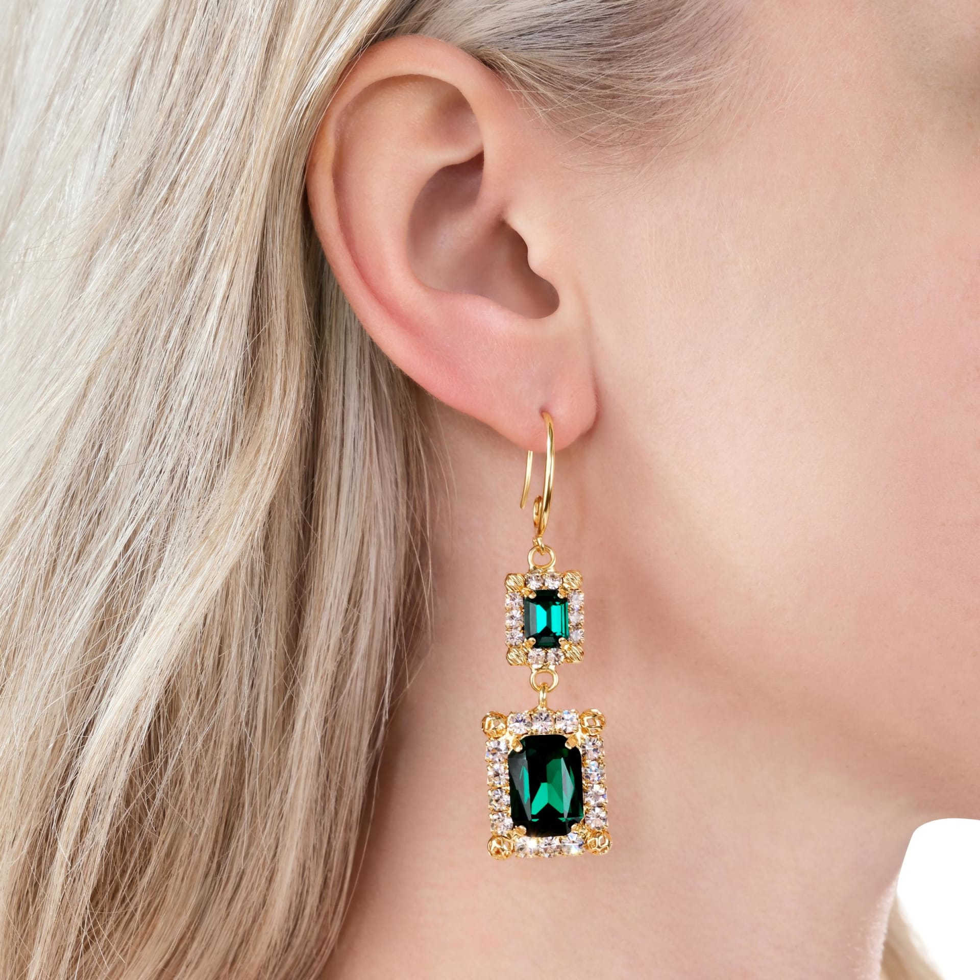Emerald green crystal drop earrings on model - luxury jewellery lifestyle photography UK