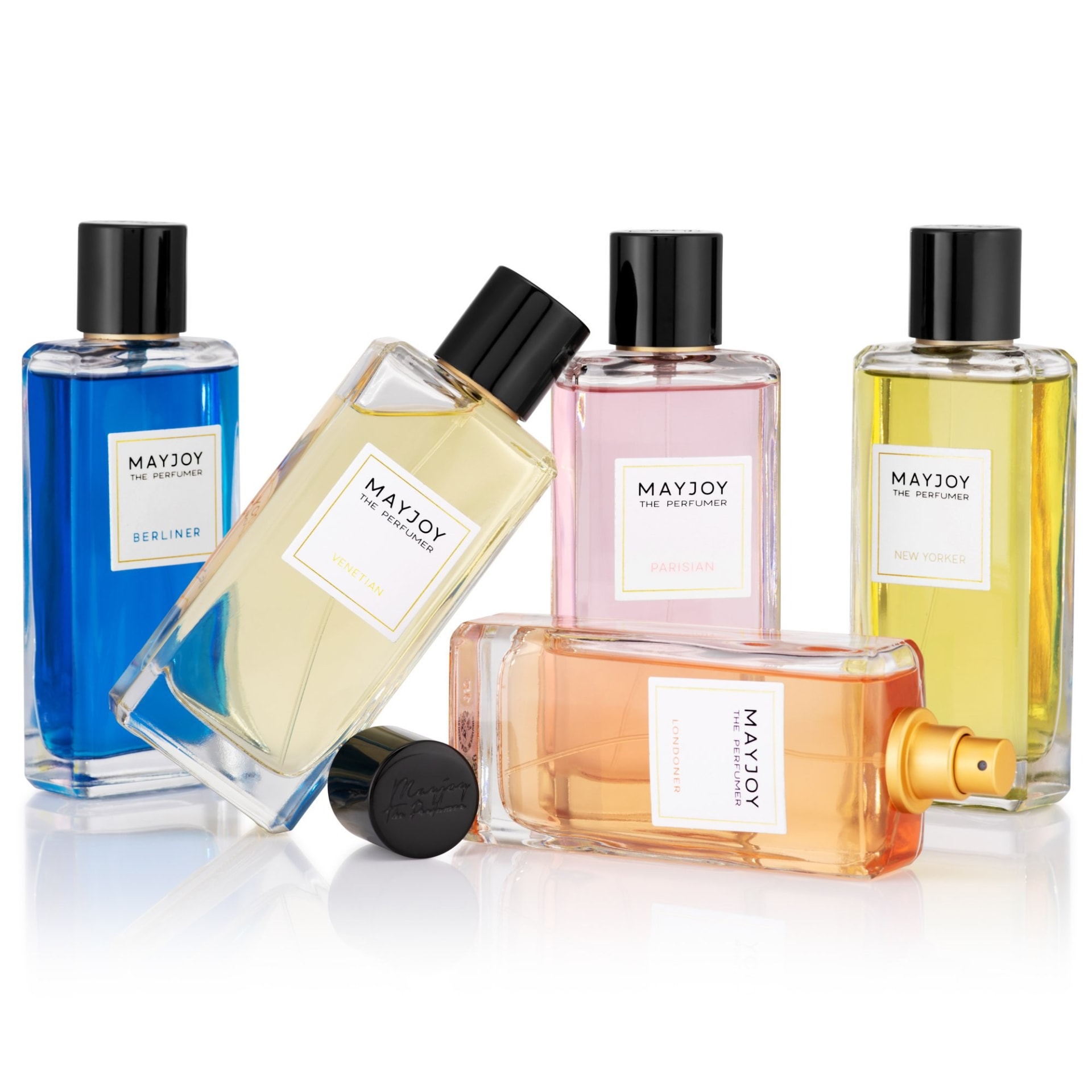 Luxury perfume bottles collection colourful packshot on white - beauty product photography UK