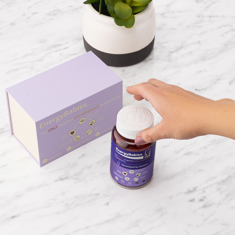 Hand holding bottle lifestyle photography