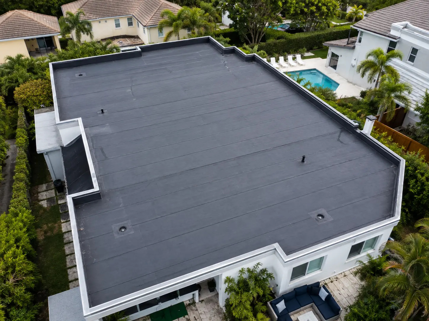 Aerial view of EPDM flat roof installation on South Florida home