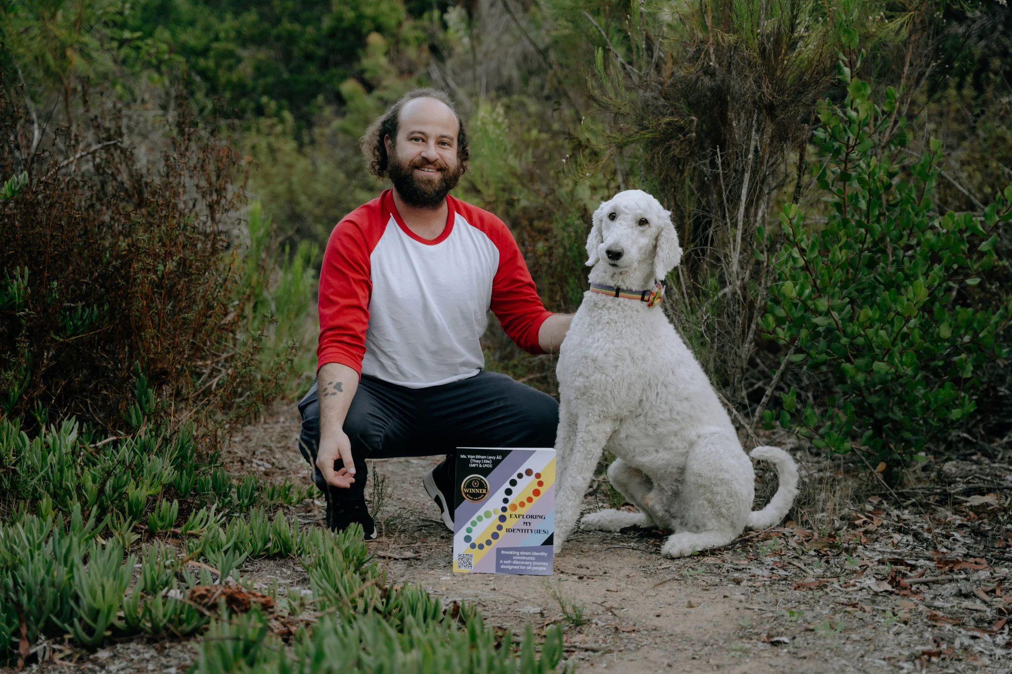 Van with Sunny and Sushi, whose paw rests on Van’s arm. Sushi passed in March 2024, and continues to inspire Van’s work and heart.