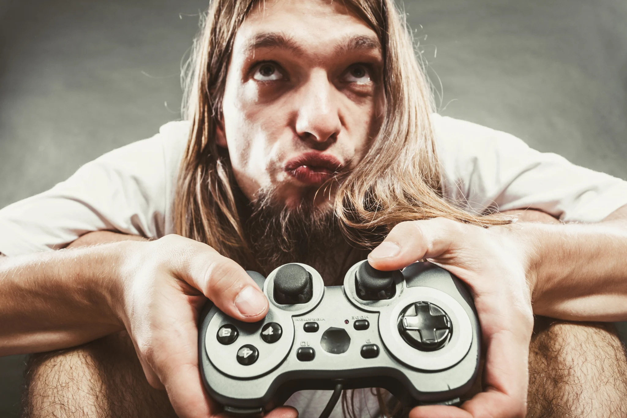 Teenager with gaming disorder holds controller