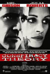 Movie poster for Conspiracy Theory, featuring Mel Gibson and Julia Roberts, exploring themes of mental health and perception.