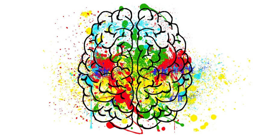 Multicolored abstract illustration of a brain representing creativity and mental health themes in therapy humor.