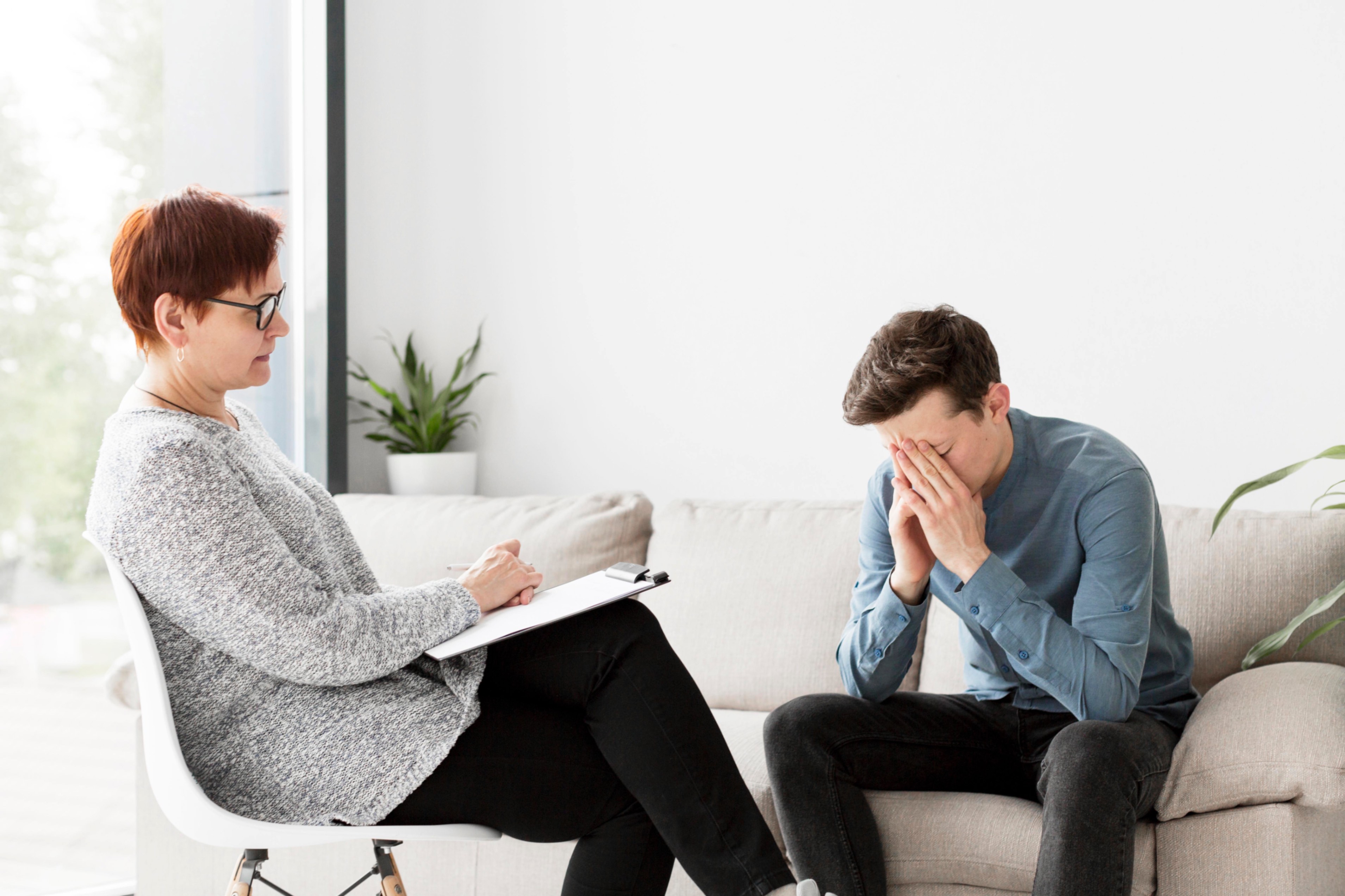 A therapist counselling a patient