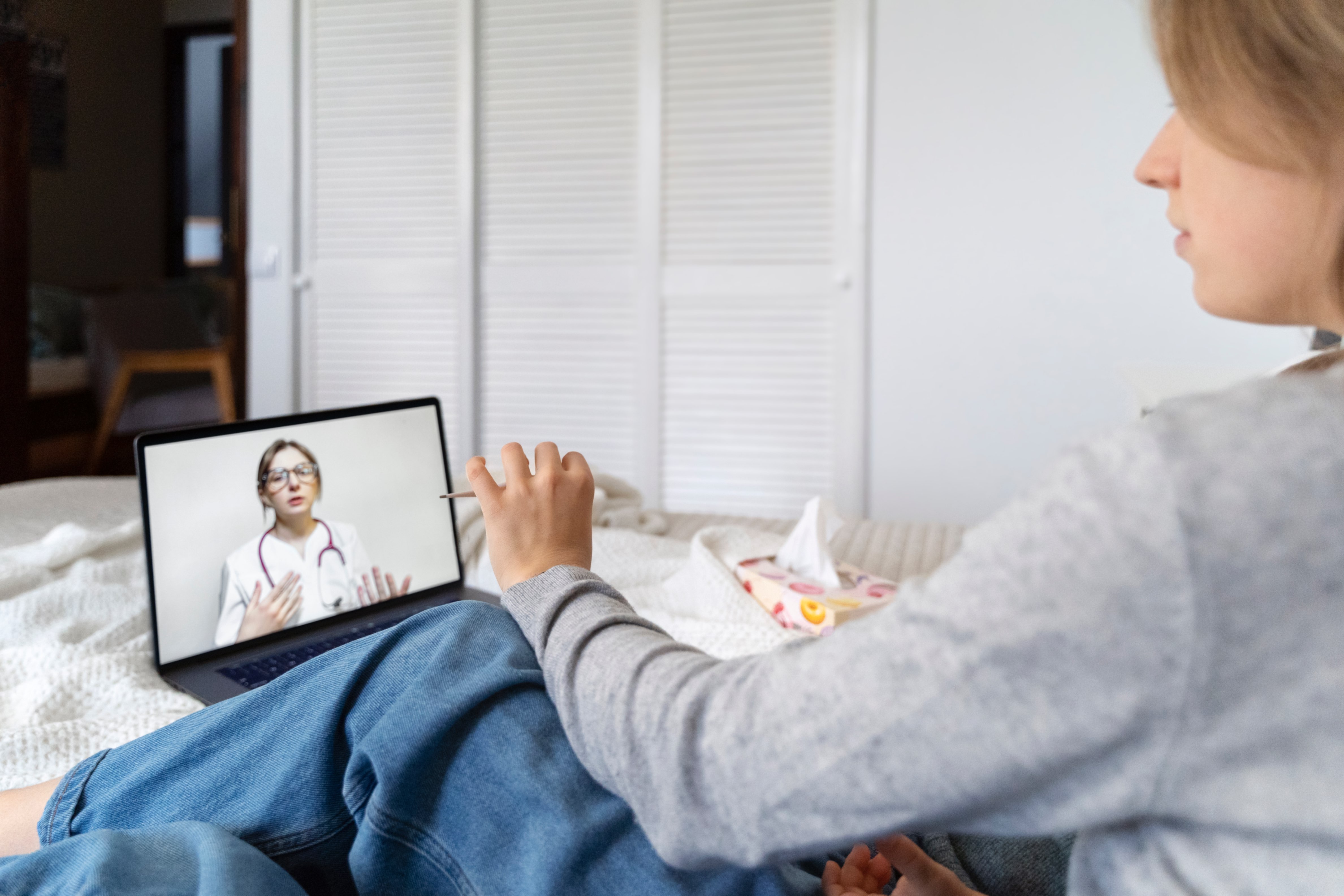 Patient having teleconsultation with a therapist