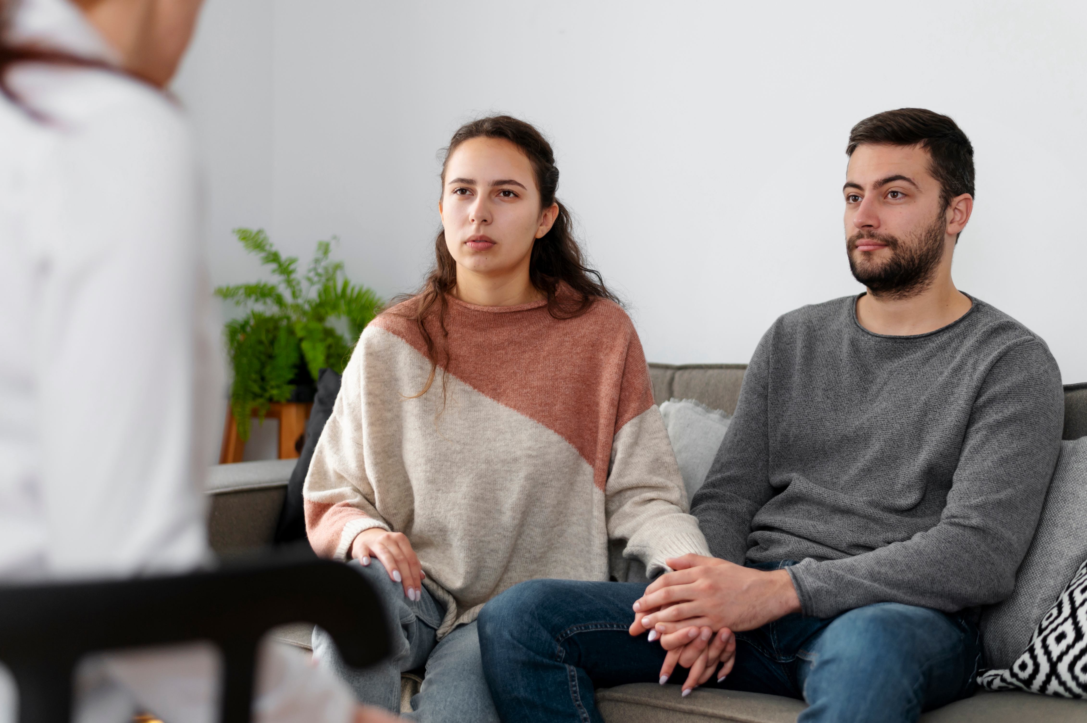 A married couple attending a marriage counselling session