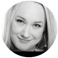 Smiling licensed clinical psychologist with blonde hair, providing therapeutic support in private practice.