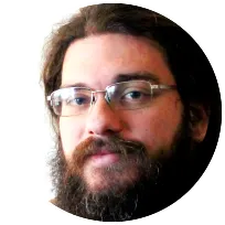 Bearded man with glasses, depicting a friendly and approachable demeanor, associated with professional counseling services.