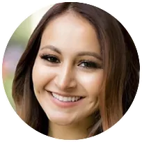 Licensed Marriage and Family Therapist smiling warmly, emphasizing a compassionate approach in supporting clients.