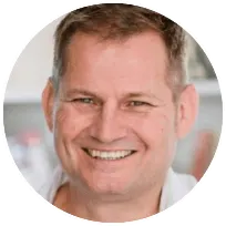 Licensed Clinical Psychologist JP smiling, emphasizing his collaborative approach in psychotherapy for adults.