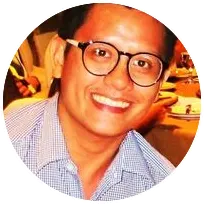 Licensed psychologist smiling, representing years of experience in clinical management and trauma care.