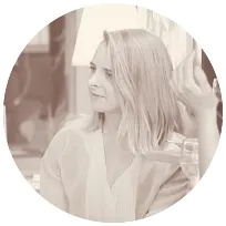 Woman with medium-length blonde hair engaged in conversation, creating a supportive environment for therapy.