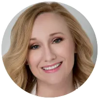 A smiling female Licensed Clinical Social Worker with long blonde hair, welcoming clients to a supportive therapy practice.