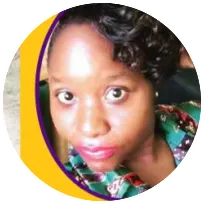 Portrait of a professional counselor, showcasing her friendly demeanor and colorful attire, reflecting her commitment to mental health support.