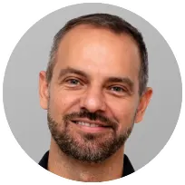 Professional male psychotherapist with a friendly expression, emphasizing an integrative and trauma-informed approach.