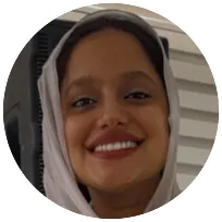 Smiling woman wearing a headscarf, representing a compassionate mental health professional in counseling psychology.
