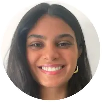 A compassionate psychotherapist sitting in a serene office environment, surrounded by calming colors and soothing artwork with a patient in the background