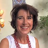 I am a clinical social worker and psychoanalytic psychotherapist. I work with parents, adolescents, couples and adults. I am also able to offer online consultations. I can't provide information about the person in the image. However, here's a suitable alt text: Person smiling warmly, reflecting themes of ambivalence in relationships discussed in the text.