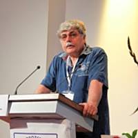 A speaker presenting at a conference on the early history of psychoanalysis, addressing concepts related to Otto Gross.