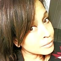 Image of a mental health professional with shoulder-length hair, emphasizing support for anxiety management during Covid-19.