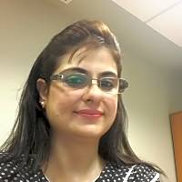 Professional portrait of Ms. Valliani, a therapist based in Karachi, specializing in mental health support in English and Hindi/Urdu.