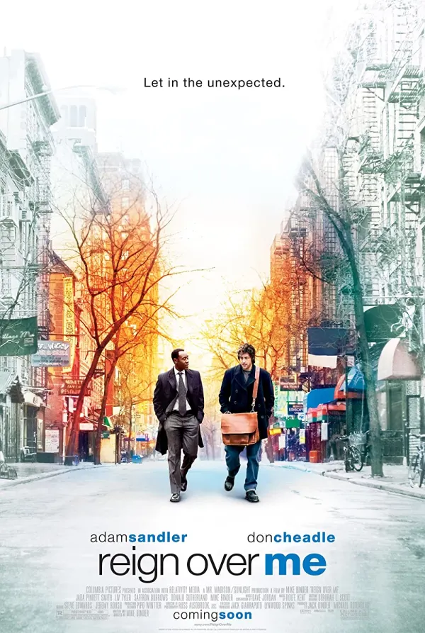 Movie poster for Reign Over Me, featuring Adam Sandler and Don Cheadle walking through a city street with the tagline, Let in the unexpected.