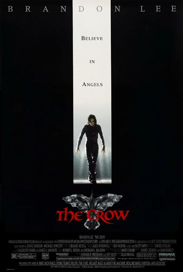 Alt text: Movie poster for 'The Crow' featuring Brandon Lee with the tagline 'Believe in Angels' and dark, dramatic visuals.