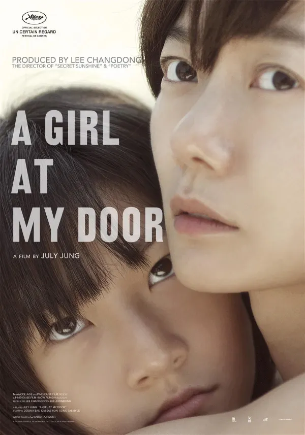 Film poster for A Girl at My Door, featuring a woman and a girl, highlighting themes of child protection and abuse awareness.