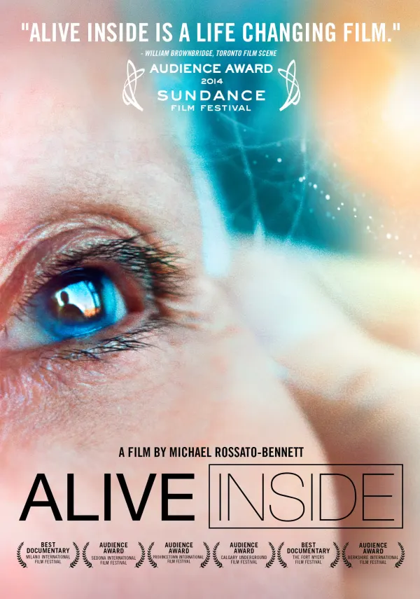 Close-up of an eye with the text Alive Inside and festival awards, highlighting a documentary about Alzheimer's impact.