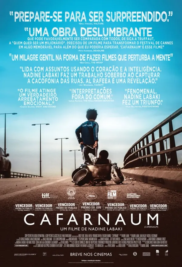 Child abuse drama film Cafarnaum poster, featuring a boy pushing a cart with a child in an urban setting.
