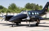 Beech Duke B60 aircraft with a Sunbrella canopy and cockpit cover installed over windshield and side windows. - Image 1 of 0