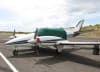 Beech Duke B60 aircraft with a Sunbrella canopy and cockpit cover installed over windshield and side windows. - Image 3 of 0