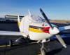 Beech Skipper B77 aircraft fitted with custom canopy, engine, and wing covers for all-weather protection. - Image 1 of 0