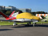Silver Sunbrella Cirrus SF-50 Vision Jet canopy and nose cover with engine, prop, wing, and empennage protection installed outdoors. - Image 1 of 0