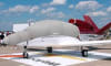 Silver Sunbrella Cirrus SF-50 Vision Jet canopy and nose cover with engine, prop, wing, and empennage protection installed outdoors. - Image 4 of 0