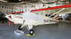 Custom Piper PA-12 Super Cruiser and J-5 Cub canopy cover installed, showing reflective Silver Sunbrella fabric protecting the windshield and cabin windows. - Image 2 of 0