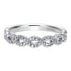 This 14k white gold diamond wedding band features white gold bands that loop around one another for a beautiful effect! - Image 1 of 0