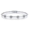 This station style white gold diamond bangle features cluster set diamond sections that total o.40 carats in diamonds, with bead style finishes in white gold down the bangle. - Image 1 of 0