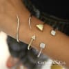 An open cuff with some intrigue, this 14k yellow gold bracelet shows off a hammered texture on one side and round brilliant diamonds on the other! - Image 3 of 0
