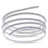 A swirling 14k white gold diamond bangle with over 2 carats of diamond splendor. - Image 1 of 0