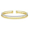 This 14k two tone cuff bangle features one half carats of diamonds. - Image 1 of 0